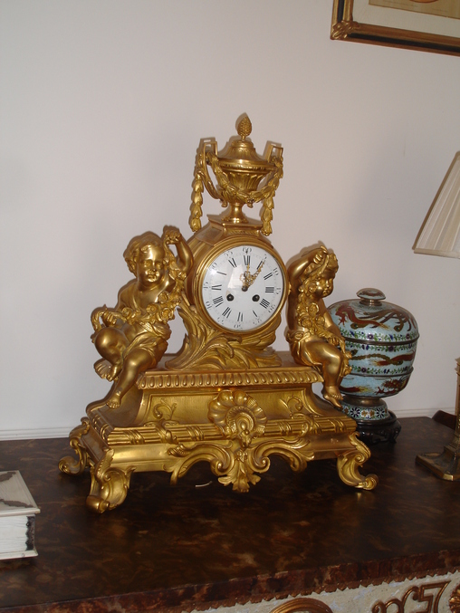 A Gilt Ormolu Clock